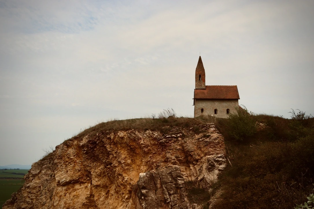 A small church above a rocky cliff